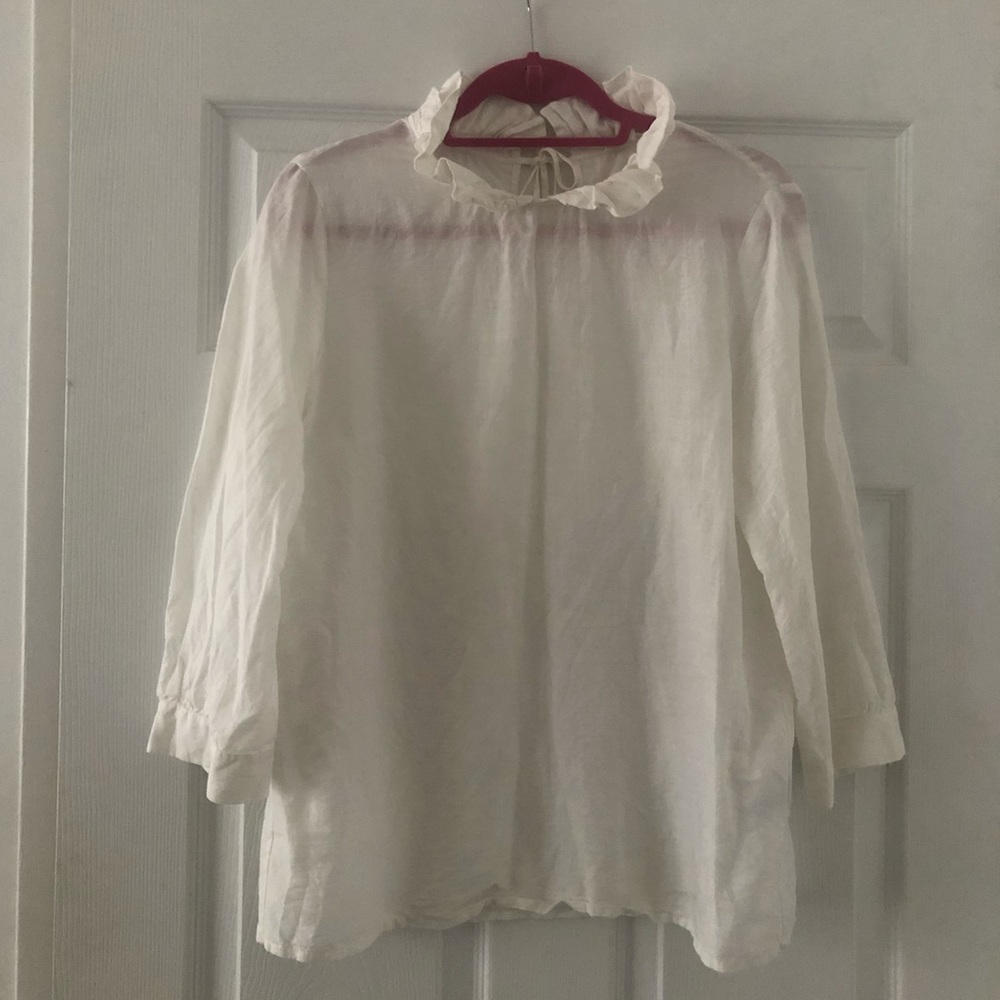 White blouse with ruffle collar